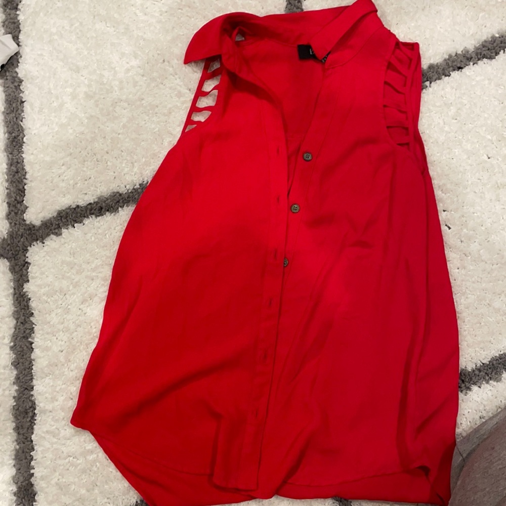 solid red sleeveless blouse with strap cutouts